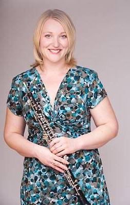 Dr. Marlena Vavrikova holding an oboe